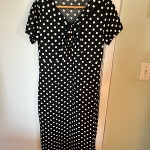 Vintage-style polka dot dress, white on black. L. Adorable floppy bow at neck.